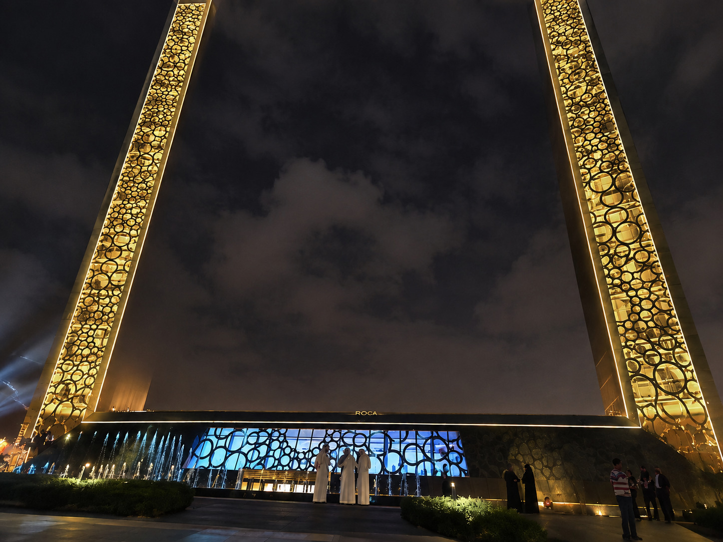 An illuminated civic landmark at night