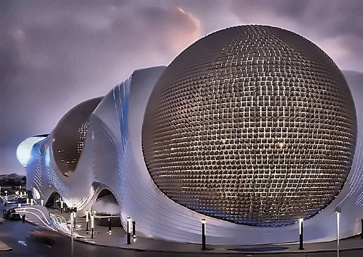 An illuminated domed mall facade at dusk